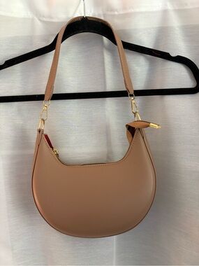 Tan faux leather purse with gold accents